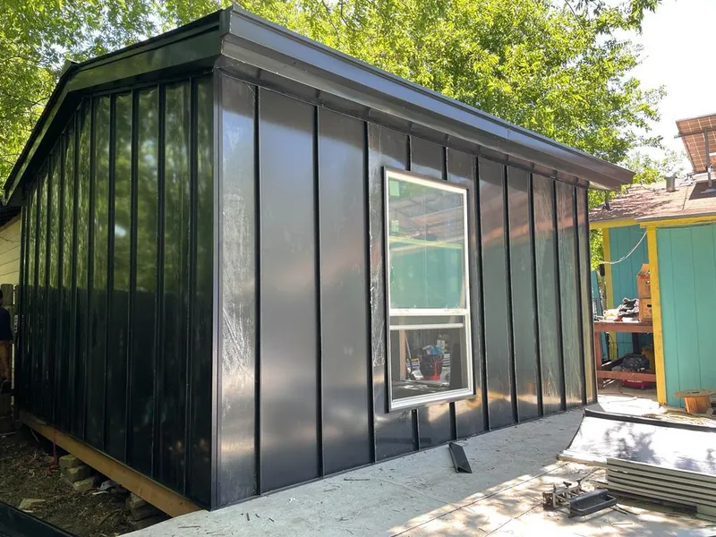 Black standing seam metal wall panels for Metal Roof Installation in Champlain