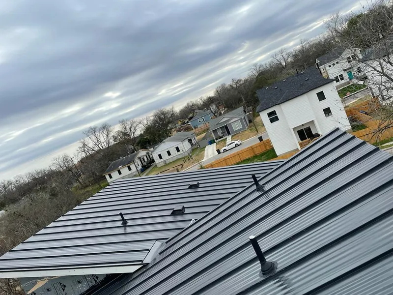 Standing seam metal roof panels with vents for Skylight Repair in Champlain